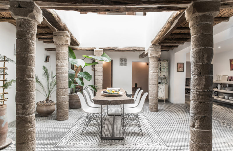 Dining area with live edge table at Five Columns Essaouira